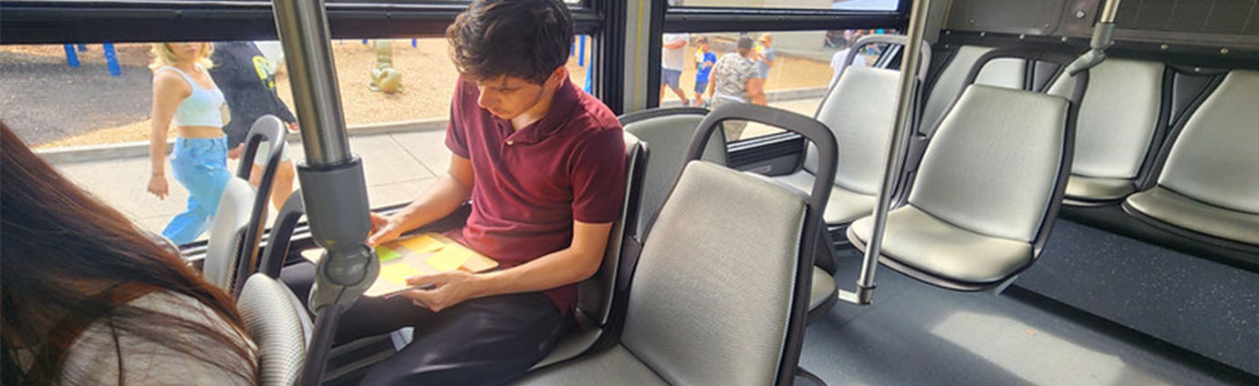Image of Student riding ART bus